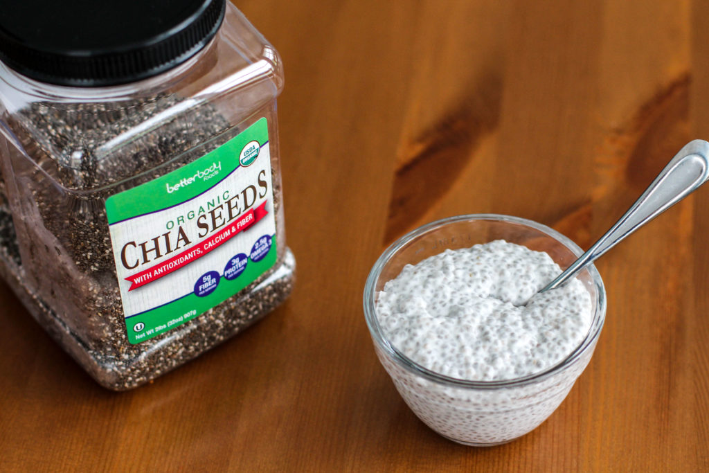 Bowl of vanilla chia seed pudding with container of chia seeds