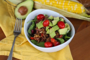 Taco Meat on salad with avocado and tomatos