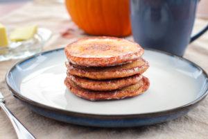 stack of pumpkin pancakes on a plate