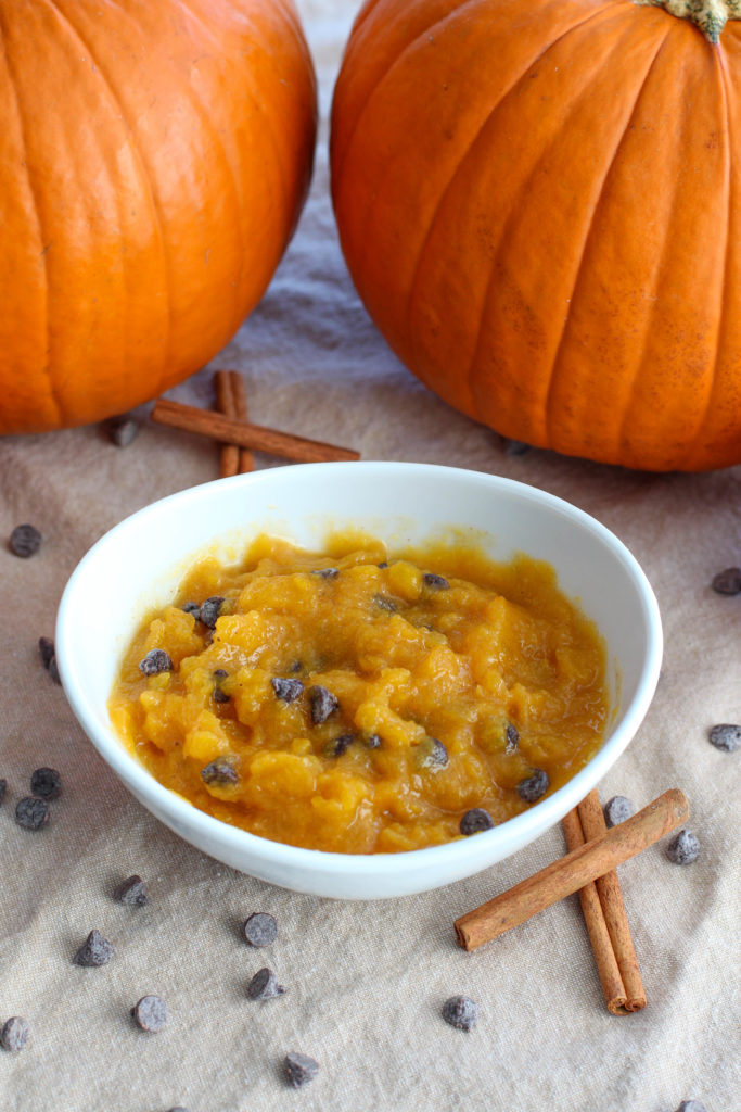 White bowl with pumpkin dip and chocolate chips