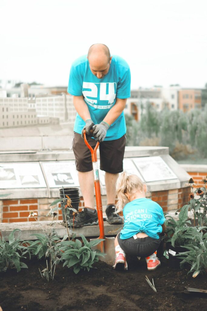 dad and little girl volunteering together as an idea for the 5 love languages