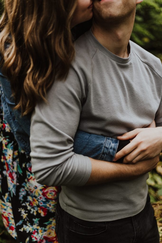 couple hugging woman behind man - 5 love languages physical touch