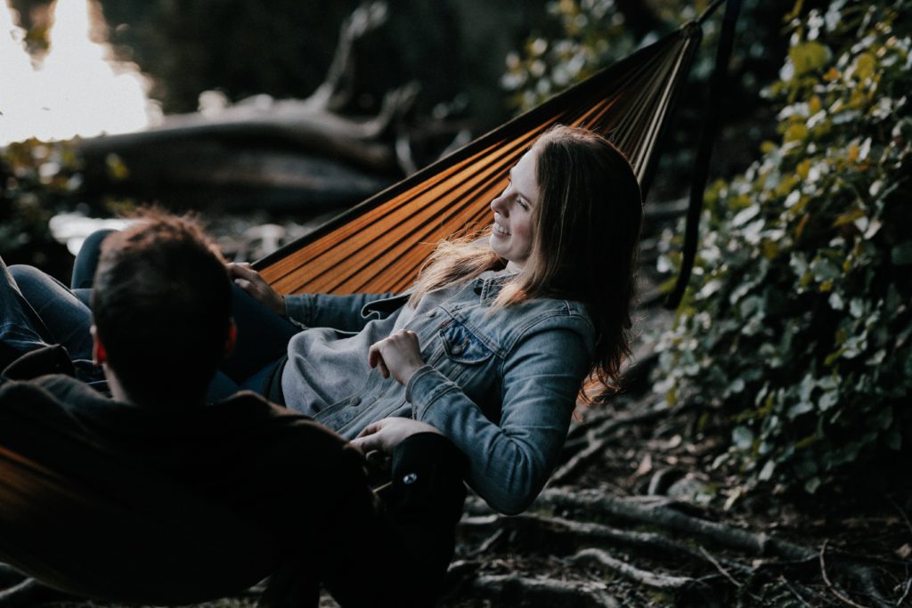 couple lounging in hammock talking - 5 love languages quality time