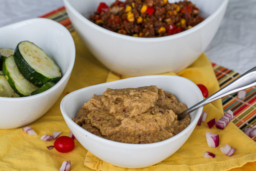 Bowl of bean-less refried beans with taco meat and zucchini