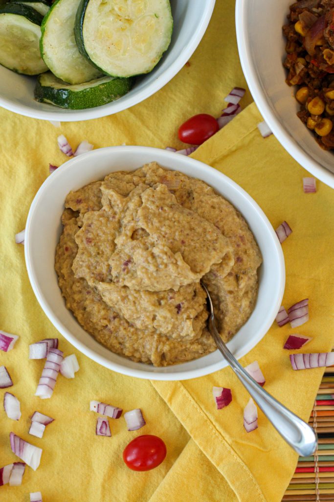 White bowl filled with bean-less refried beans