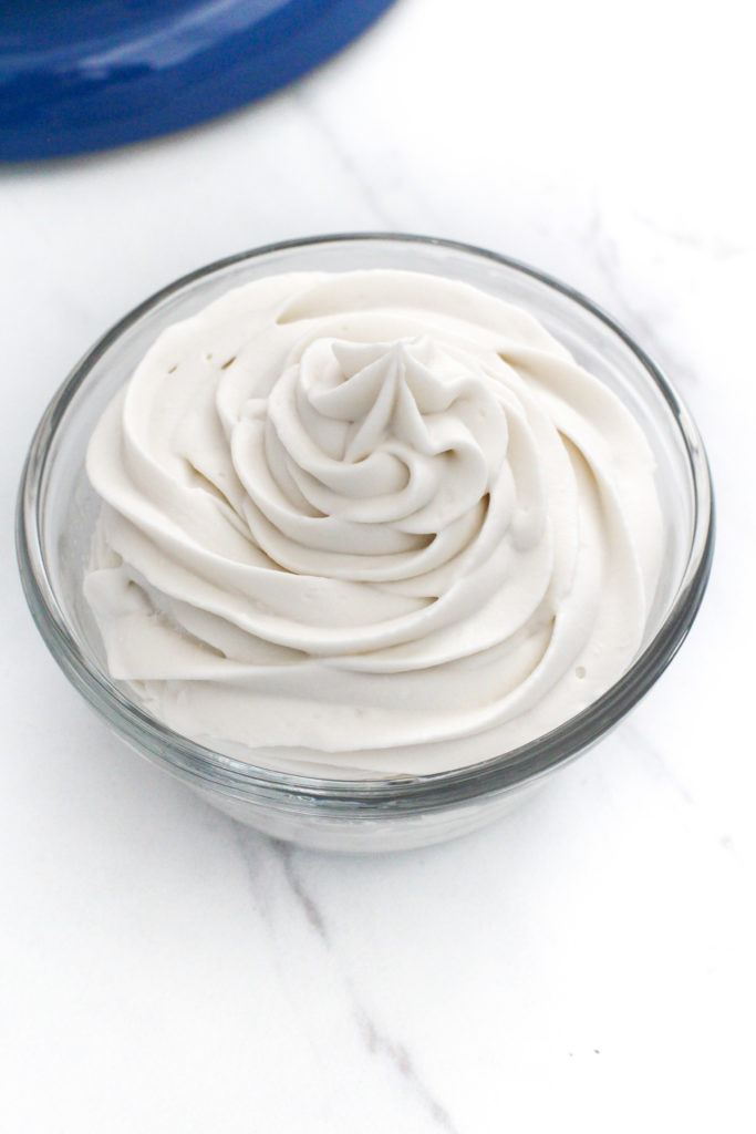 small glass bowl of swirled homemade cool whip