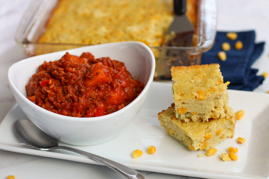 cornbread stacked next to bowl of chili