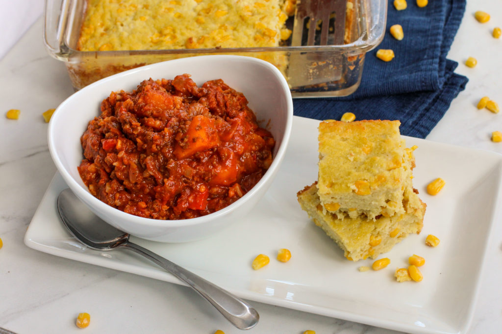 cornbread stacked next to bowl of chili