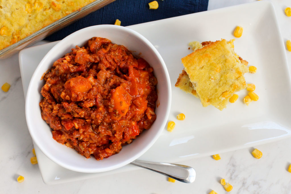 Bowl of butternut squash chili with cornbread