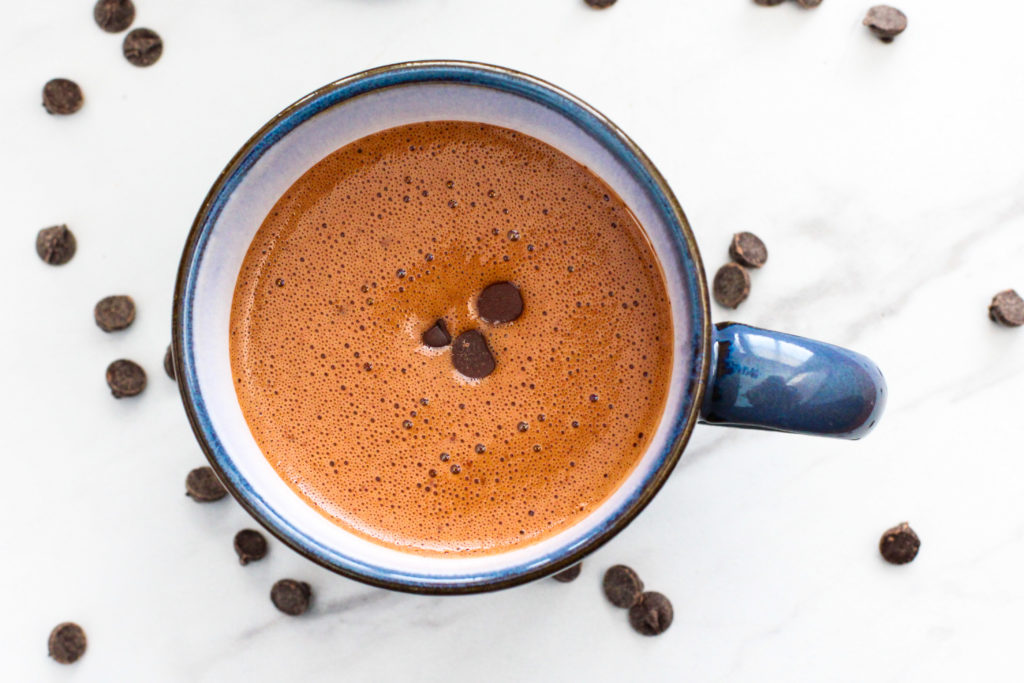 Mug of homemade hot chocolate topped with chocolate chips