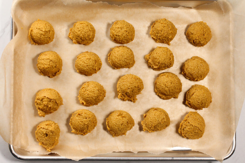 tray full of pumpkin pie truffles before being coated in chocolate sauce