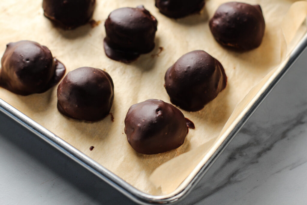 tray of chocolate dipped pumpkin pie truffles