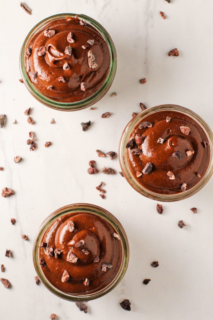 overhead view of cups of chocolate avocado pudding