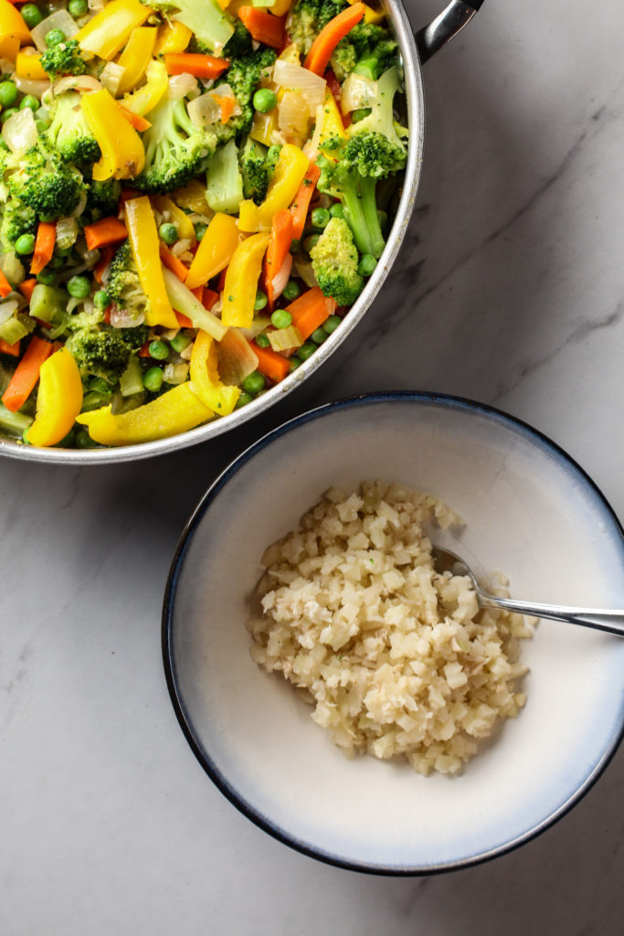 healthy stir-fry vegetables with bowl of cauli-rice