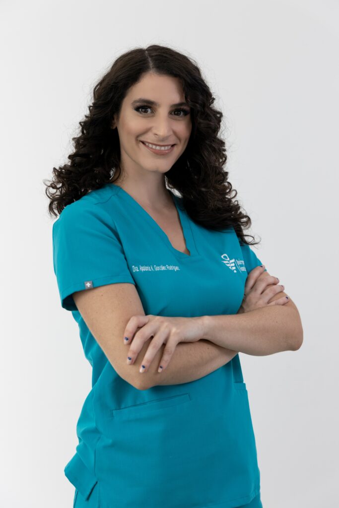 female doctor standing with arms crossed