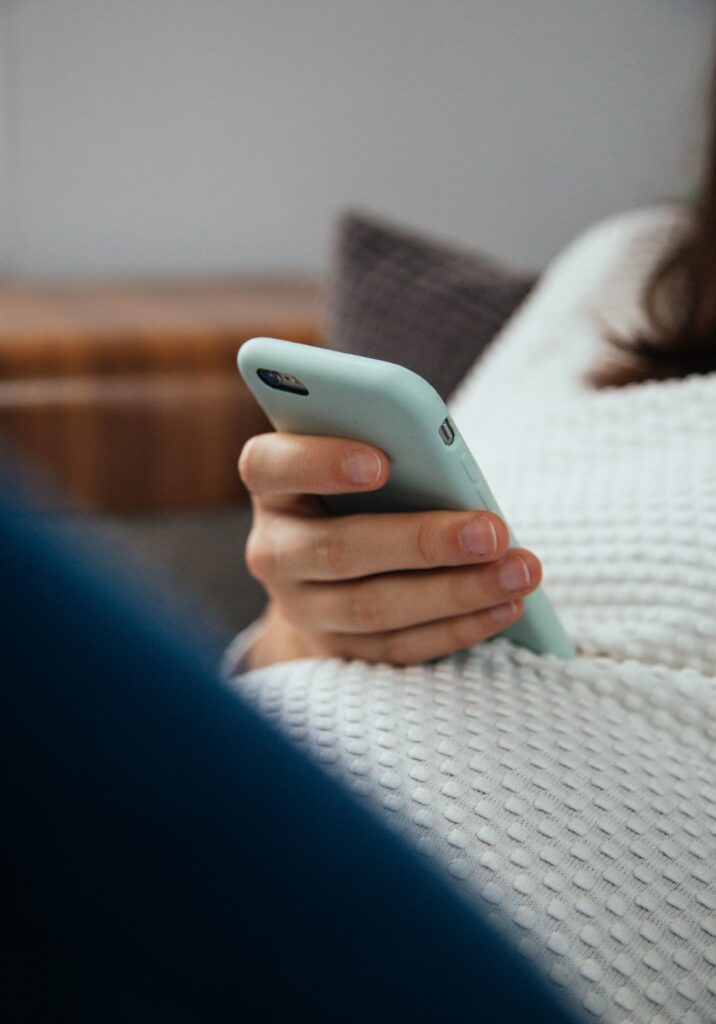 pregnant woman holding phone