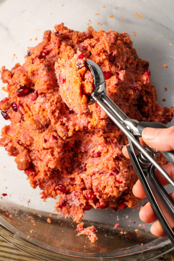 cookie scoop with cranberry orange meatball mixture