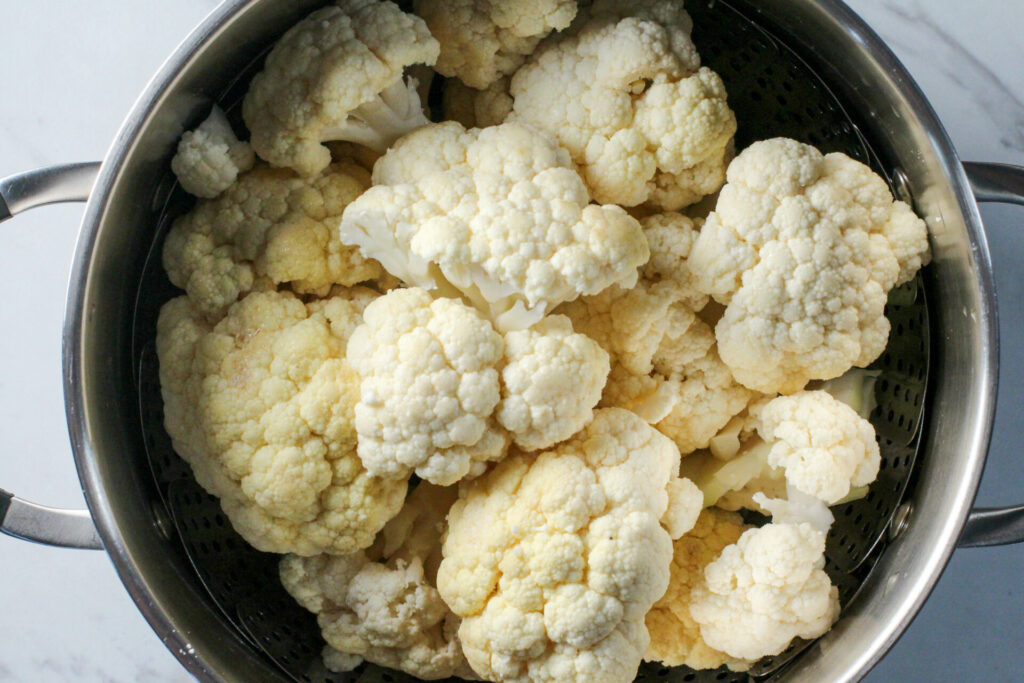 large pot filled with cauliflower florets