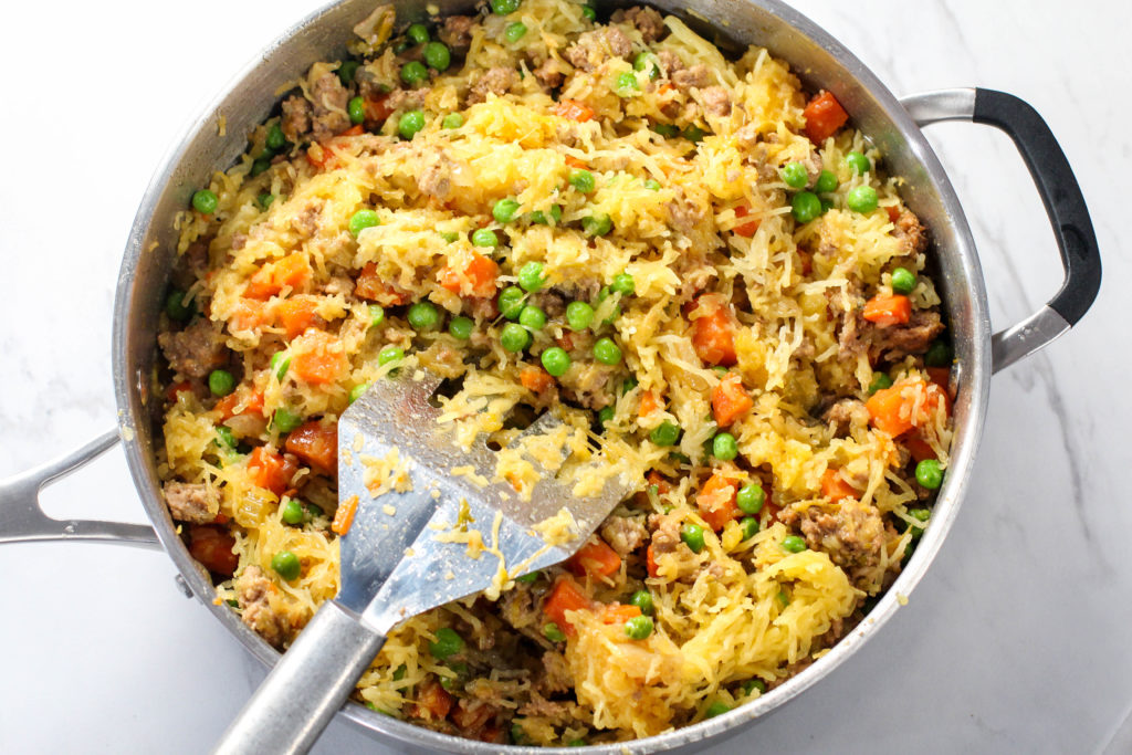 skillet of fried rice with spatula