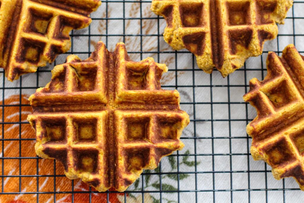 wire rack filled with pumpkin waffles