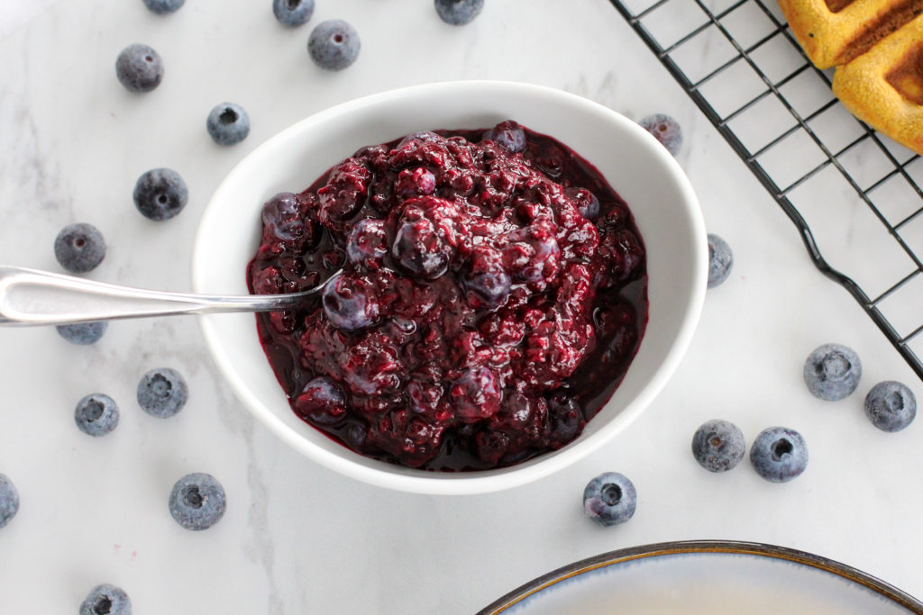 small white bowl of easy berry compote