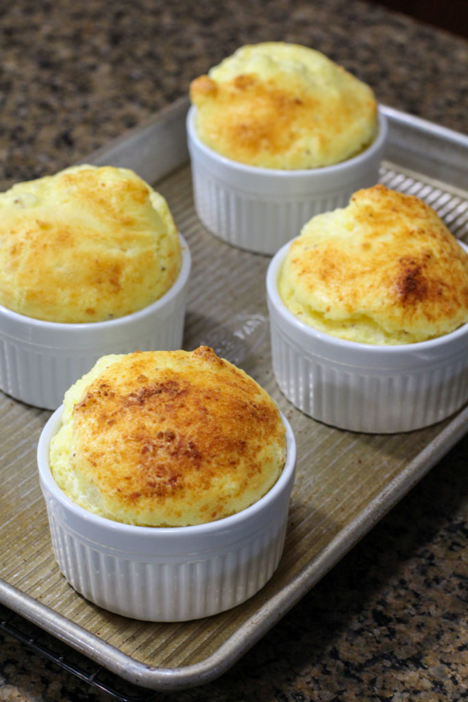 tray of cheese souffles fresh out of the oven