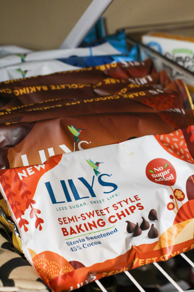 Row of bags of lily's chocolate chips in pantry