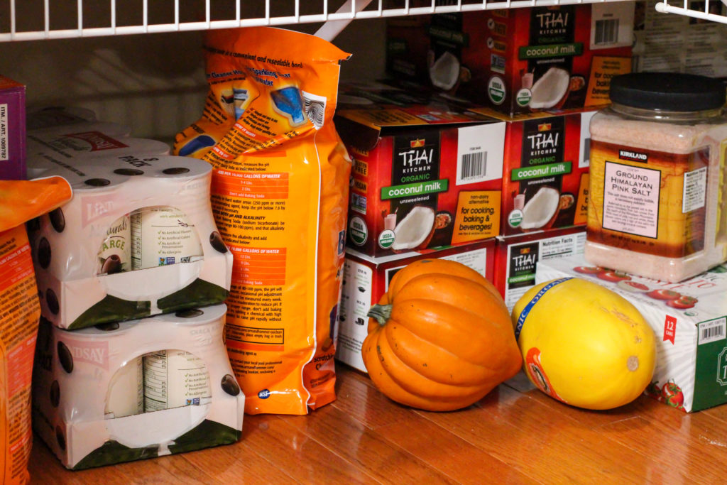 Pantry stash of coconut milk on the floor