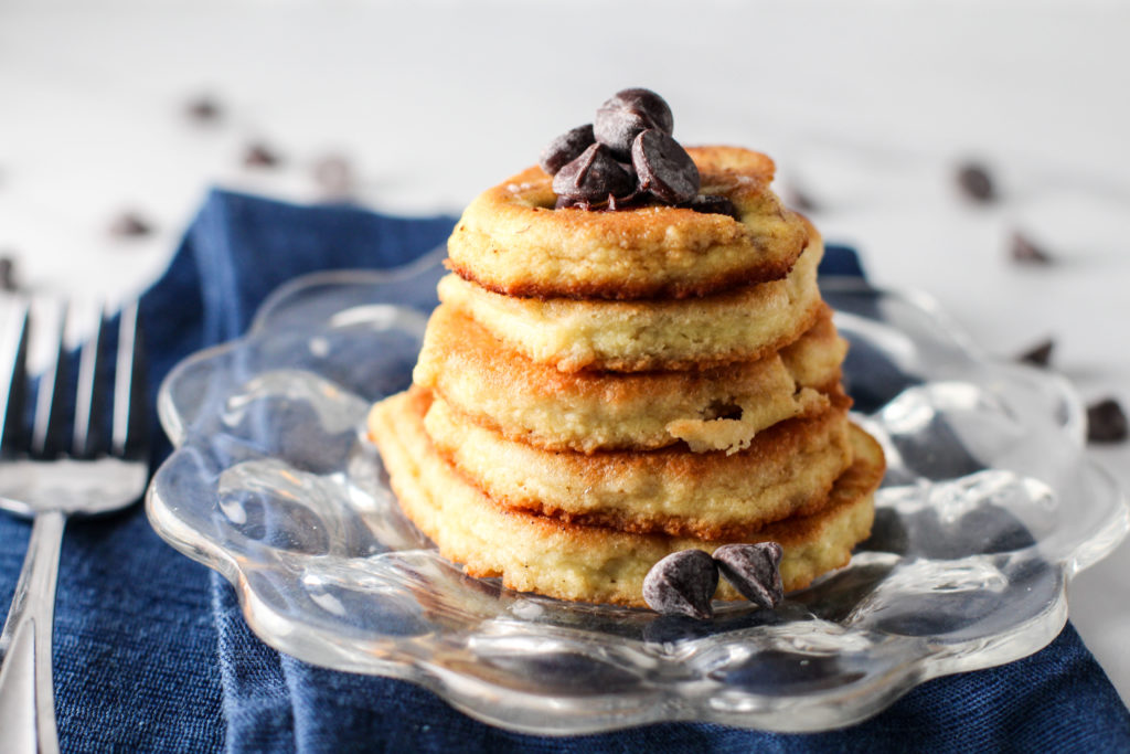 small glass plate with stack of easy chocolate chip pancakes