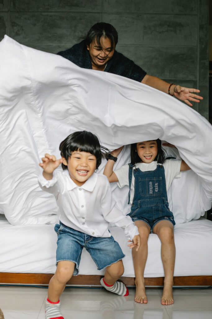 kids running under sheets