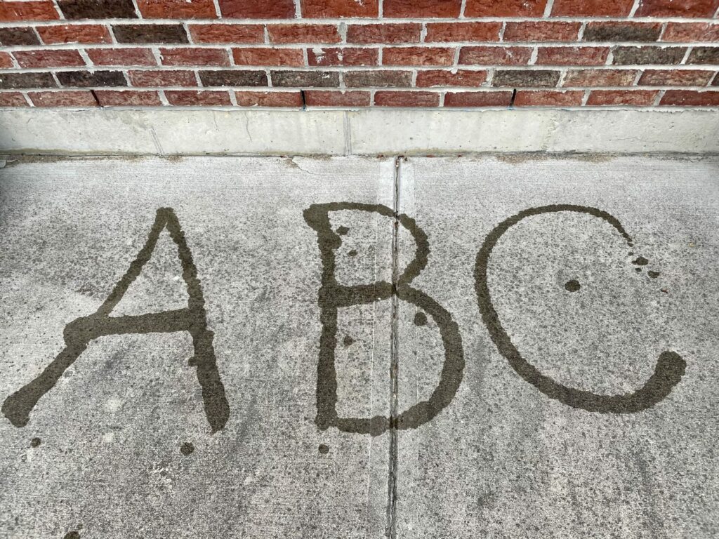 ABC spelled out in water on pavement easy backyard summer activities