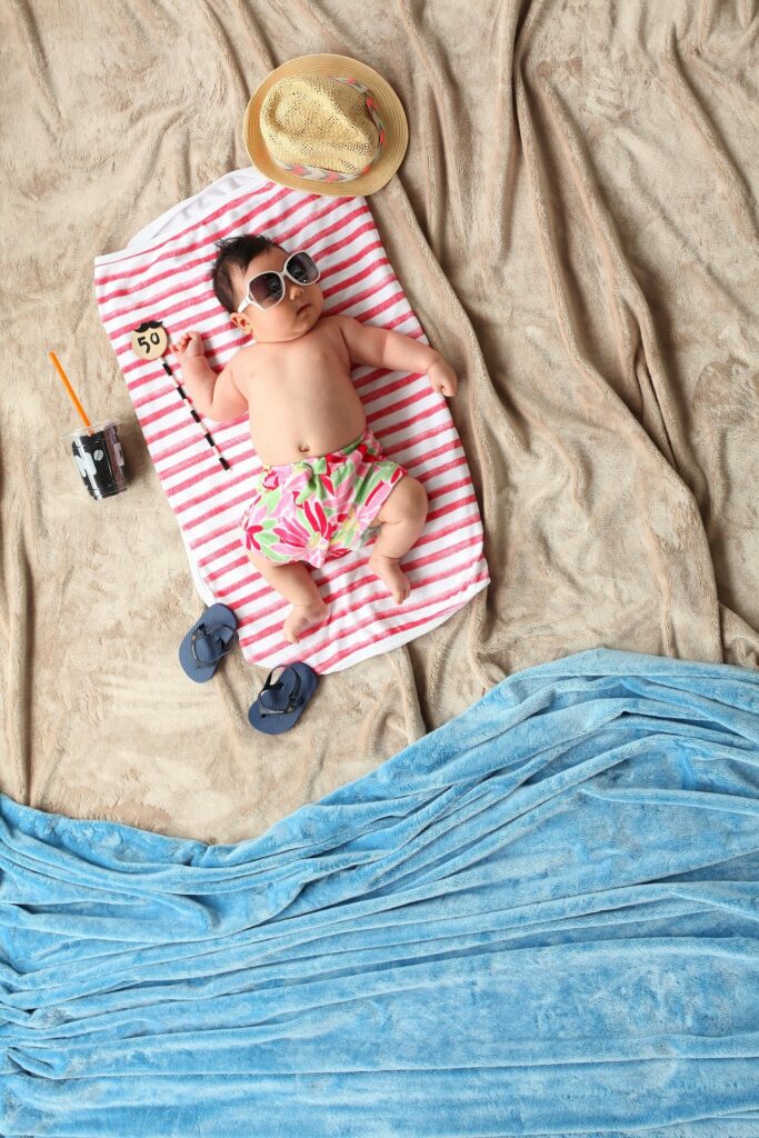 little boy pretending to be at beach