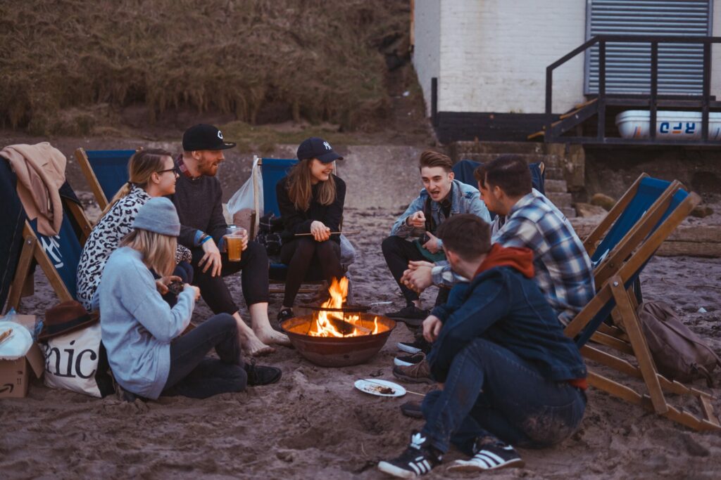 small group of people gathered around fire pit