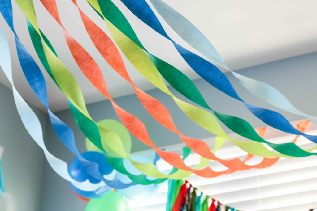 display of twisted streamers in dinosaur birthday party colors