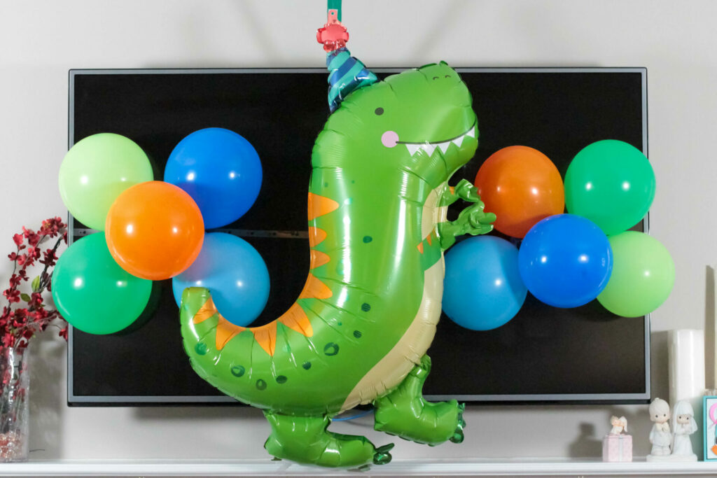 large dinosaur balloon display for dinosaur birthday party