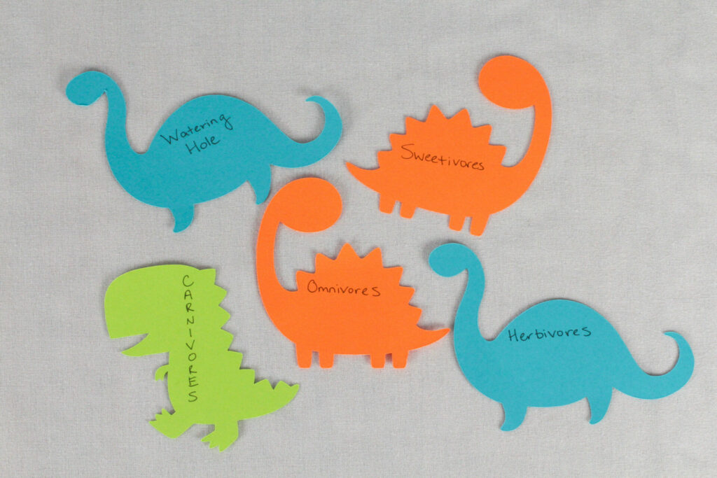 Food tags made from paper dinosaurs