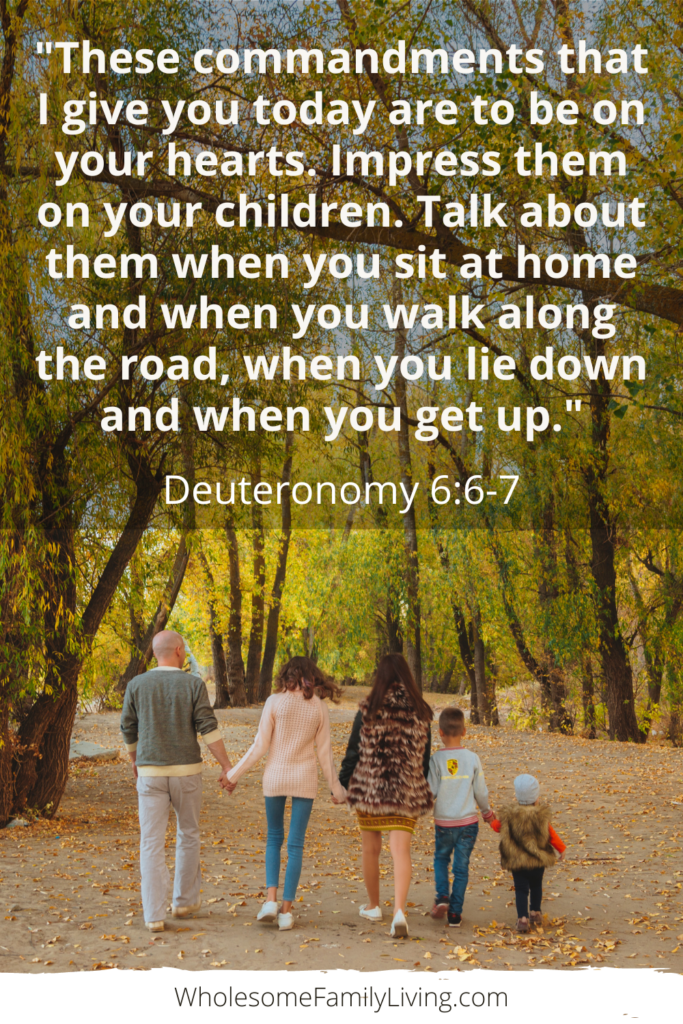 Deuteronomy 6:6-7 text with family walking along a path in the fall